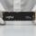 Beyaz eldivenli eller arasında tutulan Crucial P3 Plus NVMe M.2 SSD